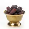 Premium Mabroom dates in a bowl, long slender brown dates with a firm chewy texture